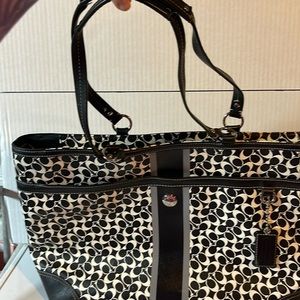 Black and white white coach purse